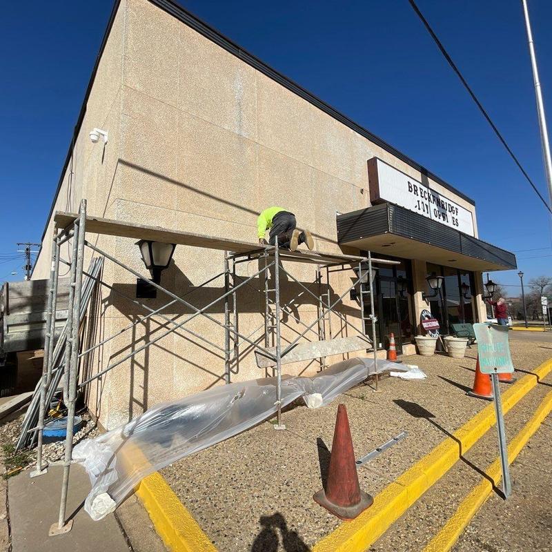 Stucco facade application on City Hall exterior walls Stucco facade application on City Hall exterior walls