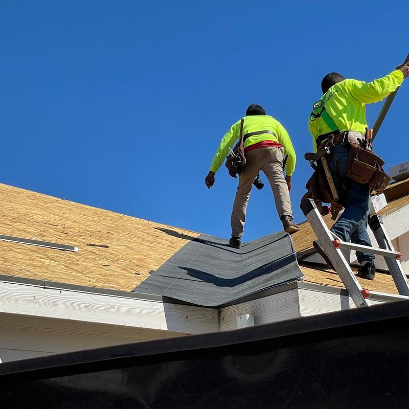 Roofing underlayment installation on residential roof Roofing underlayment installation on residential roof