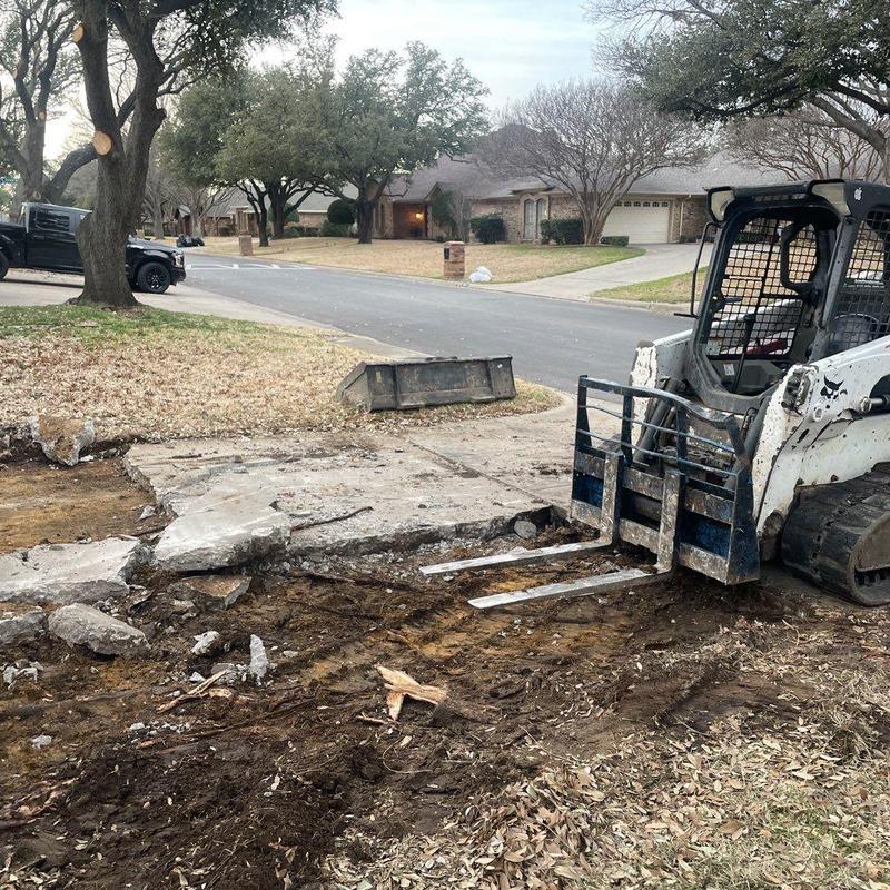 Concrete driveway demolition with skid steer loader Concrete driveway demolition with skid steer loader