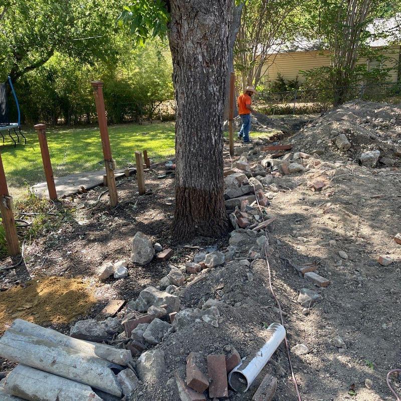 Concrete patio site with wood stakes and soil prep Concrete patio site with wood stakes and soil prep