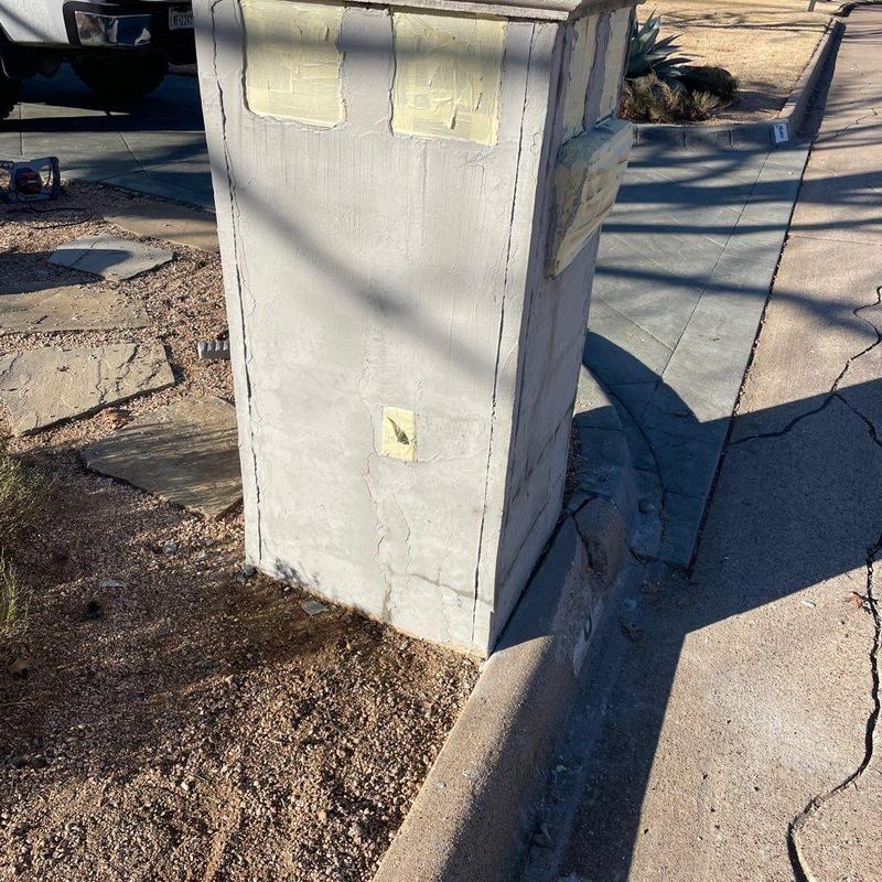 Mailbox column stucco surface with patch repairs Mailbox column stucco surface with patch repairs