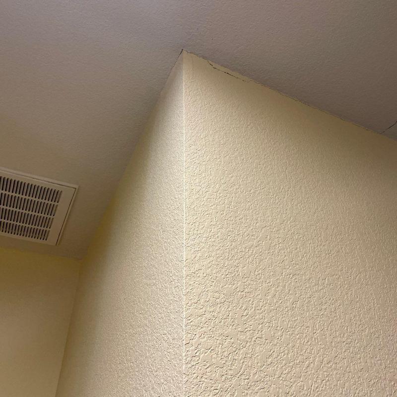 Ceiling seam and stucco wall cracks near vent Ceiling seam and stucco wall cracks near vent