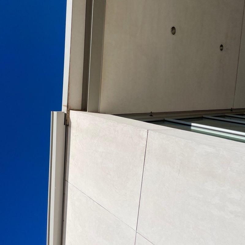 Covered soffit and wall joints on building facade Covered soffit and wall joints on building facade