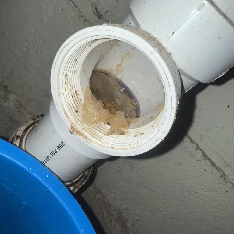 Main line sewer pipe clog with buildup inside pipe