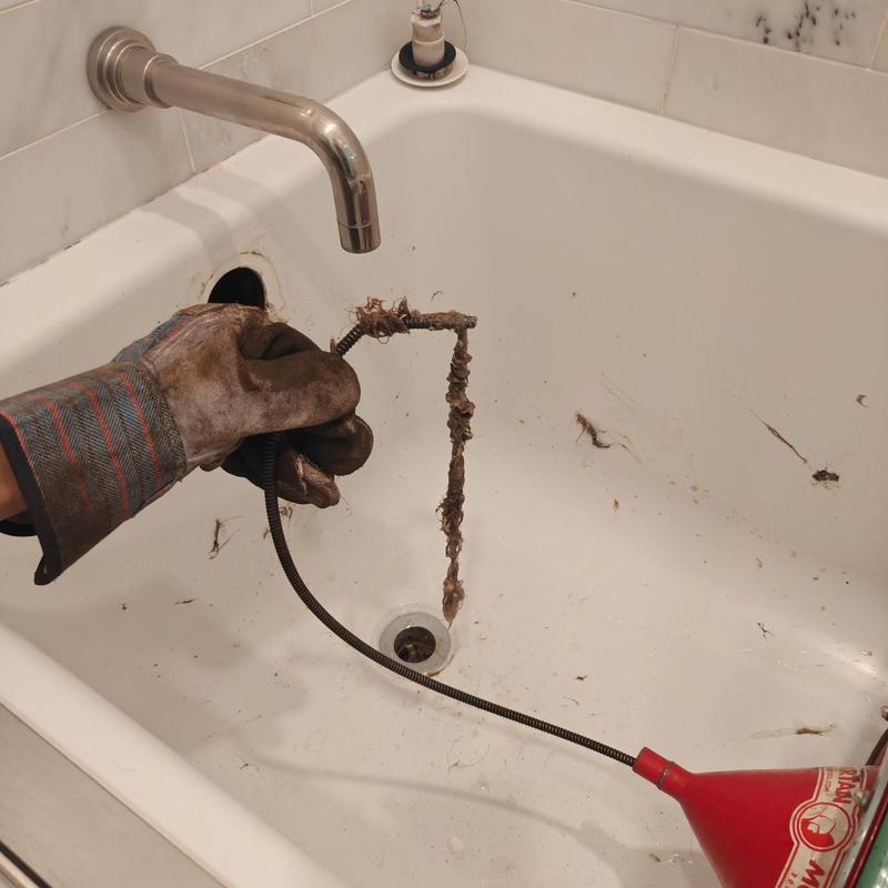 Bathtub drain cleaning with clog removal tool