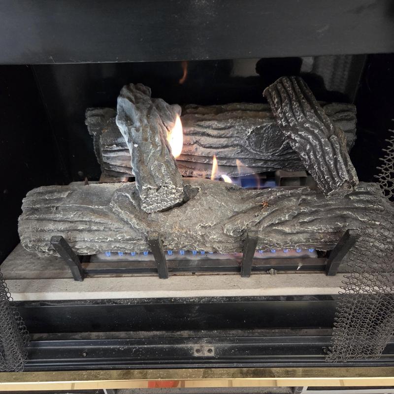 Gas fireplace burner with ceramic logs igniting in Colorado Springs Gas fireplace burner with ceramic logs igniting in Colorado Springs