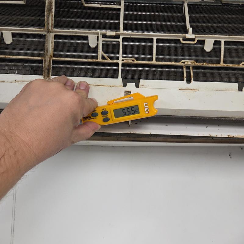 AC unit temperature check with handheld thermometer AC unit temperature check with handheld thermometer