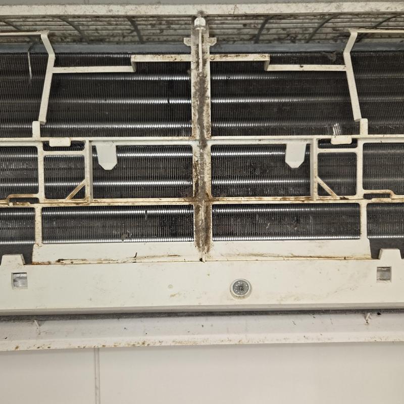 AC unit evaporator coil with dirty grille and buildup AC unit evaporator coil with dirty grille and buildup