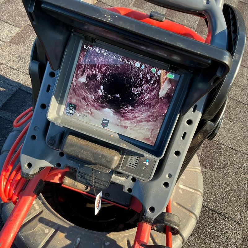 Sewer line inspection camera showing internal pipe buildup