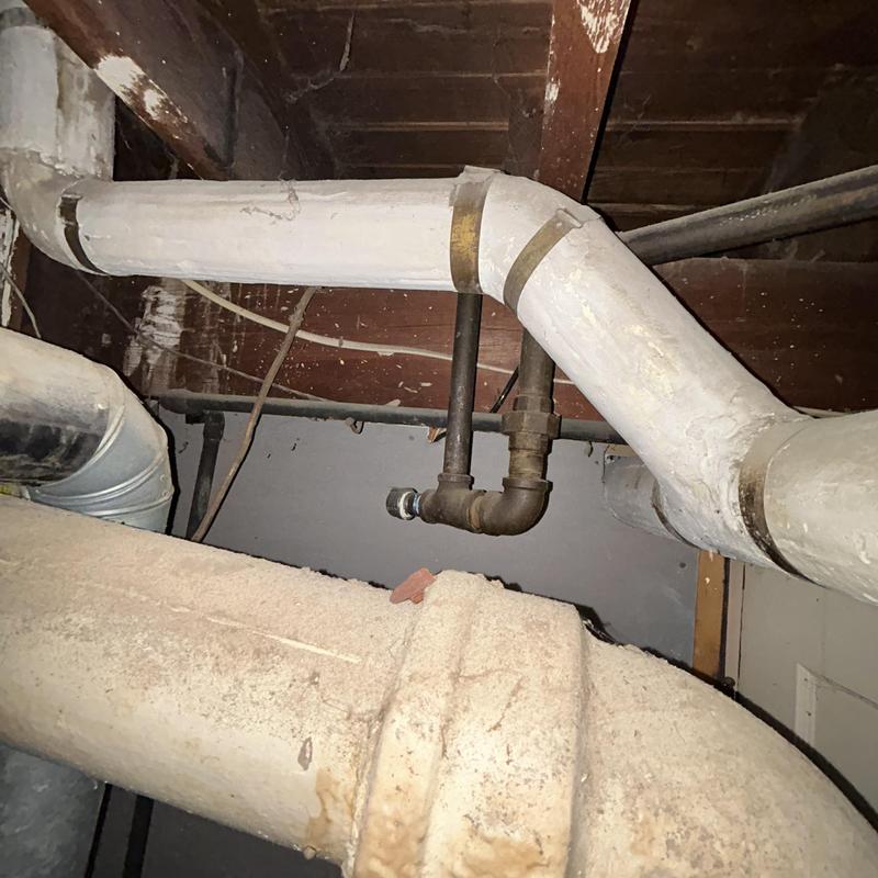 Gas piping behind oven with leak inspection setup Gas piping behind oven with leak inspection setup