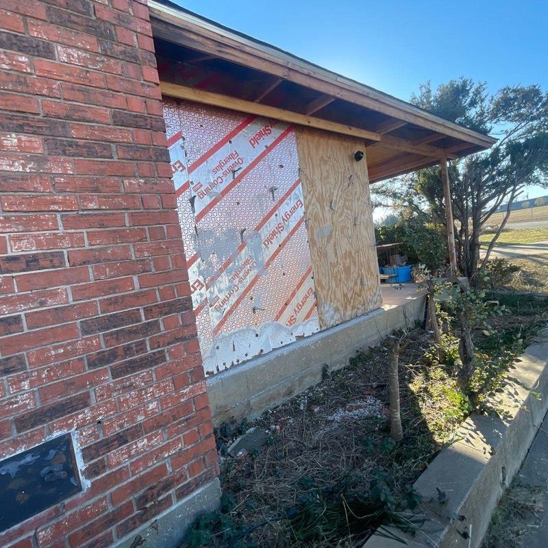 Brick exterior installation on home patio area Brick exterior installation on home patio area