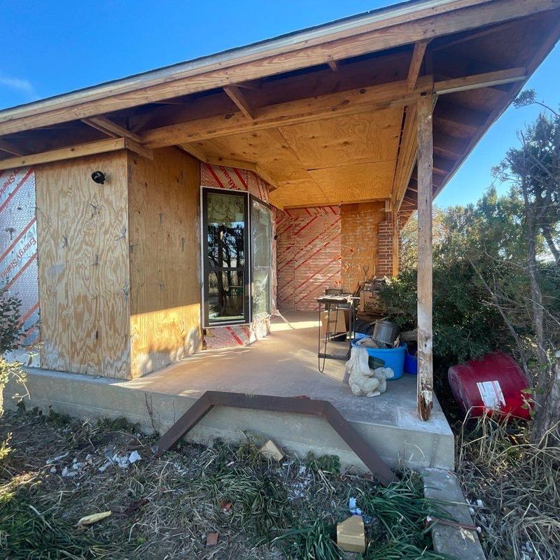 Brick exterior installation around covered patio Brick exterior installation around covered patio
