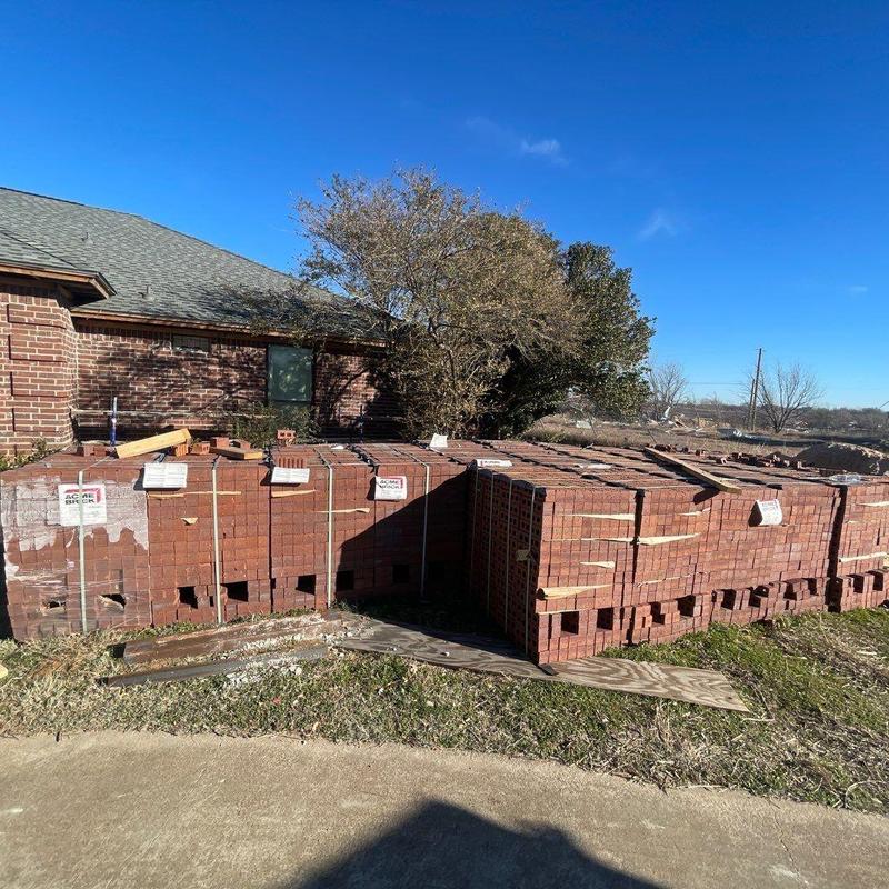 Brick exterior materials stacked onsite for home patio addition Brick exterior materials stacked onsite for home patio addition