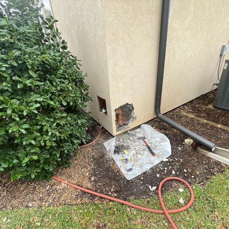 Stucco exterior wall with water damage repair tools Stucco exterior wall with water damage repair tools