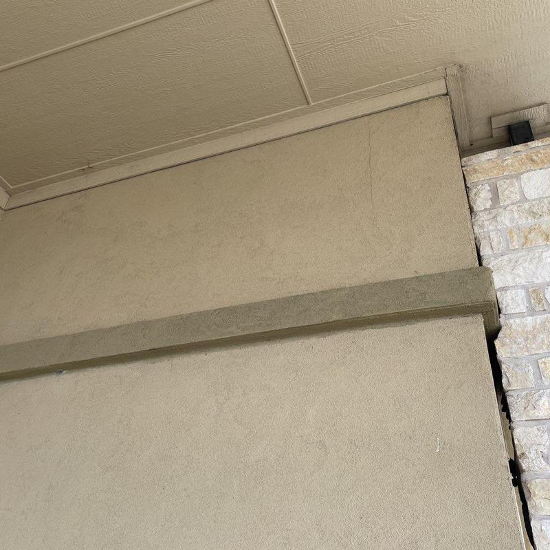 Stucco exterior wall cracks and seams at building facade Stucco exterior wall cracks and seams at building facade