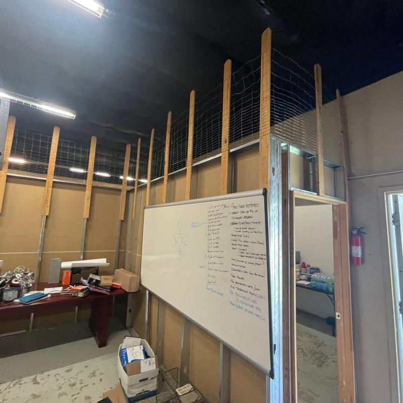 Whiteboard installation with wood framing and wire mesh Whiteboard installation with wood framing and wire mesh