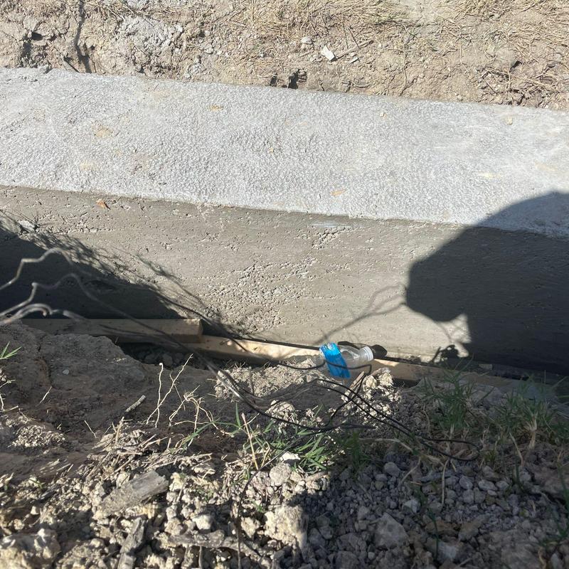 Concrete block retaining wall footing beside pool Concrete block retaining wall footing beside pool
