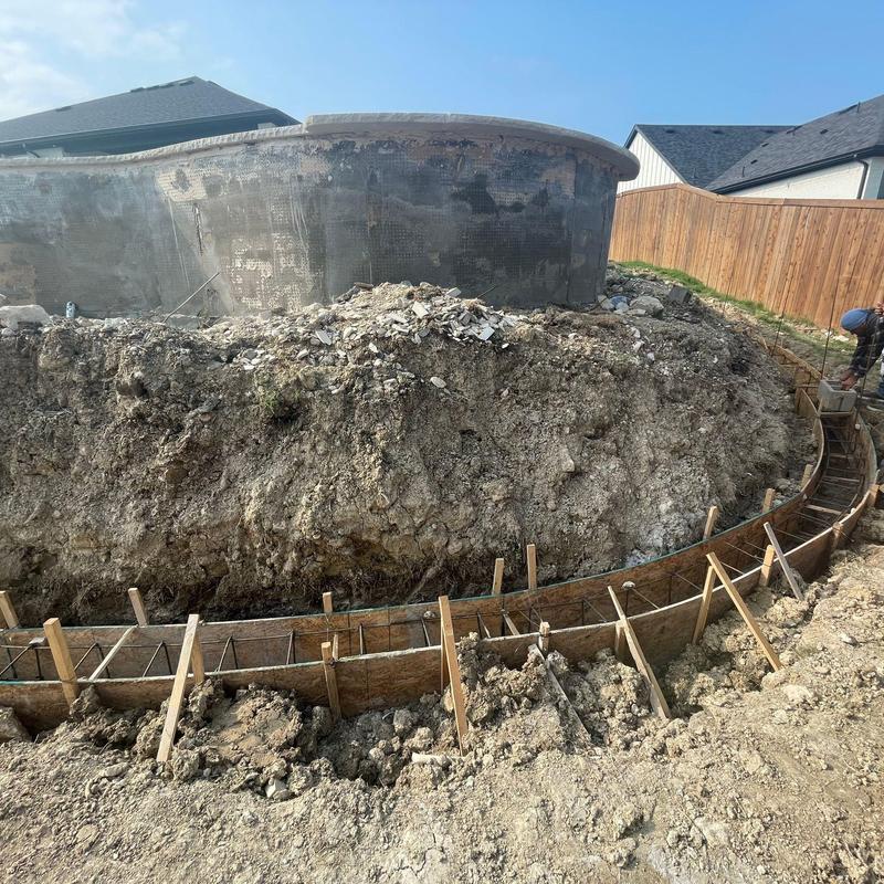 Concrete block retaining wall footing forming beside pool Concrete block retaining wall footing forming beside pool