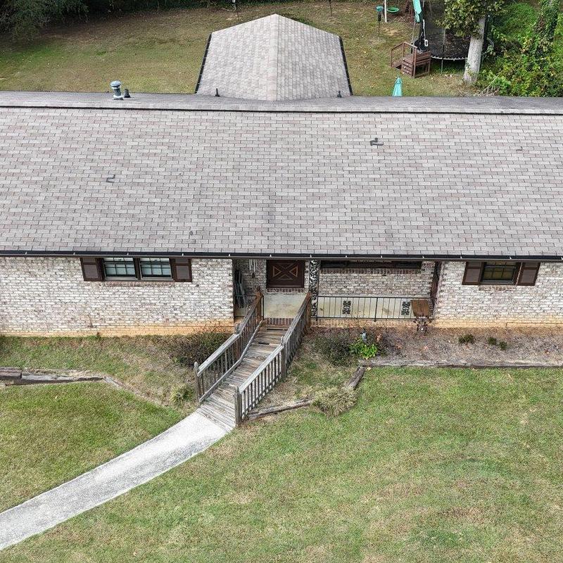 Asphalt shingle roof on single-story brick home Asphalt shingle roof on single-story brick home