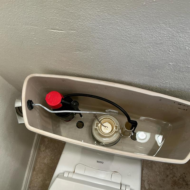 Toilet fill valve inside tank with new seal installed