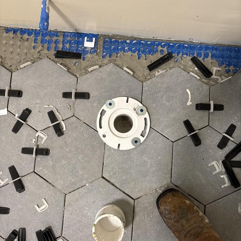 Toilet flange installation on hex tile floor Toilet flange installation on hex tile floor