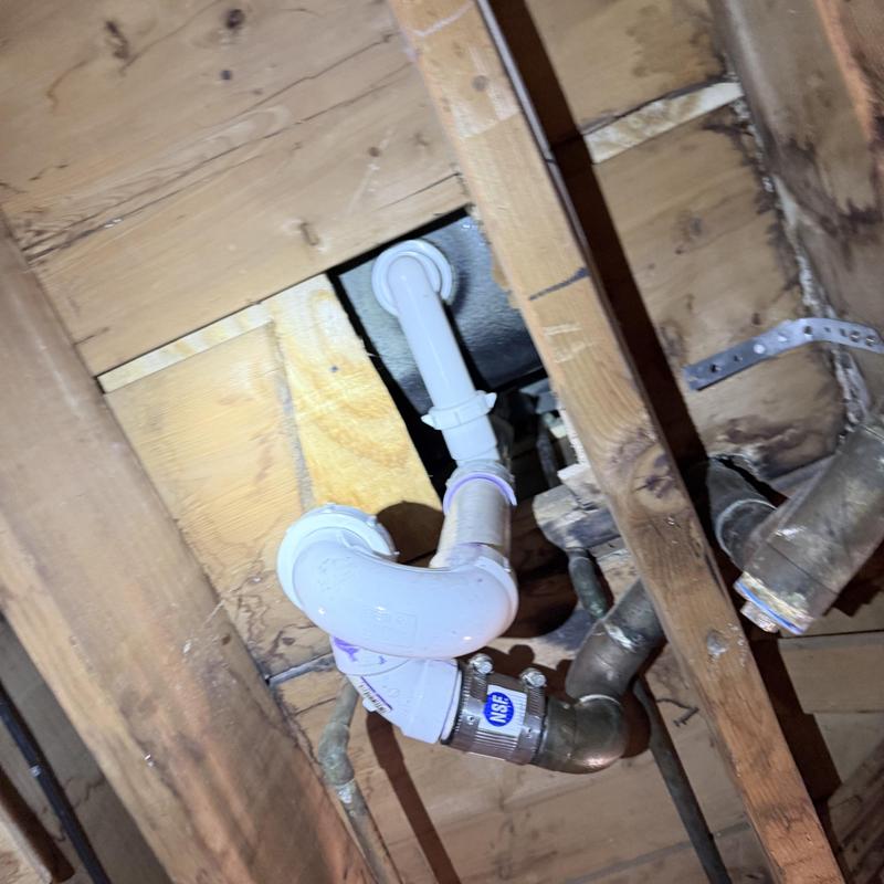 Tub drain plumbing under floor with PVC piping