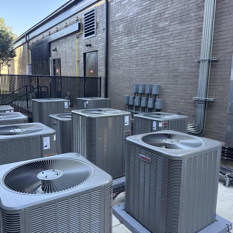 Commercial HVAC air conditioning units in outdoor mechanical area Commercial HVAC air conditioning units in outdoor mechanical area