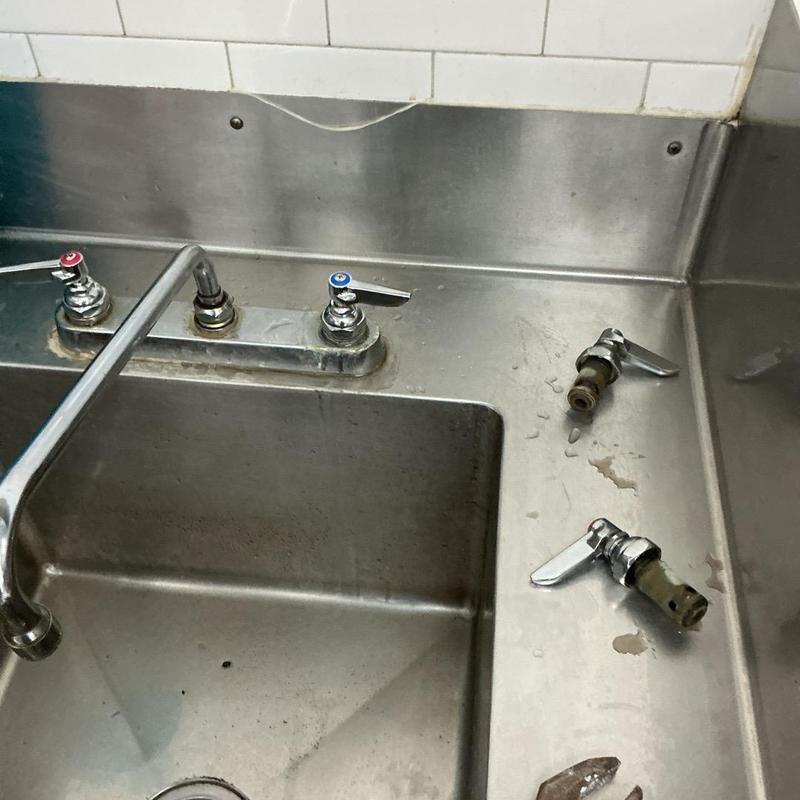 Commercial kitchen prep sink faucet stems removed for repair Commercial kitchen prep sink faucet stems removed for repair