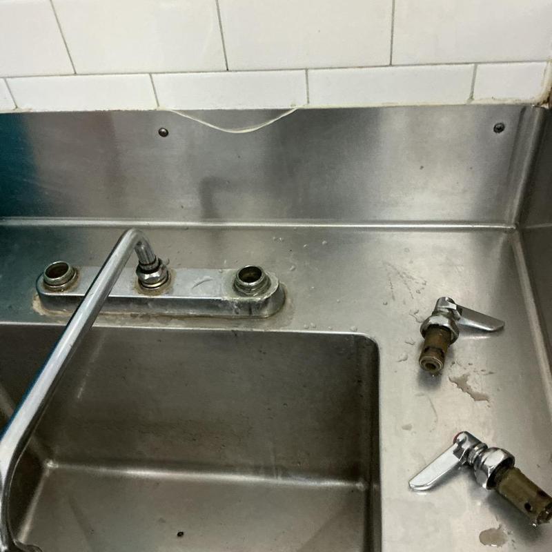 Commercial kitchen sink faucet with removed stems Commercial kitchen sink faucet with removed stems