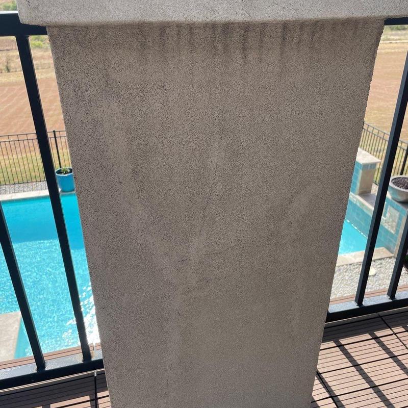 Stucco surface on raised patio balcony wall Stucco surface on raised patio balcony wall