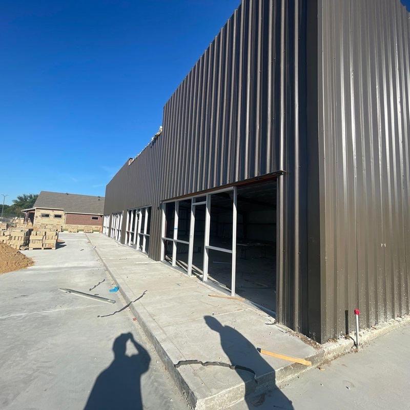 Concrete walkways and curbs at commercial building site Concrete walkways and curbs at commercial building site