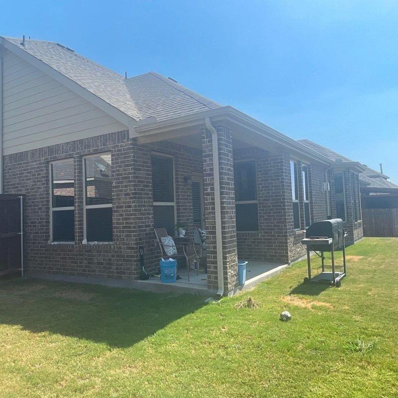 Brick exterior and covered patio with grill Brick exterior and covered patio with grill