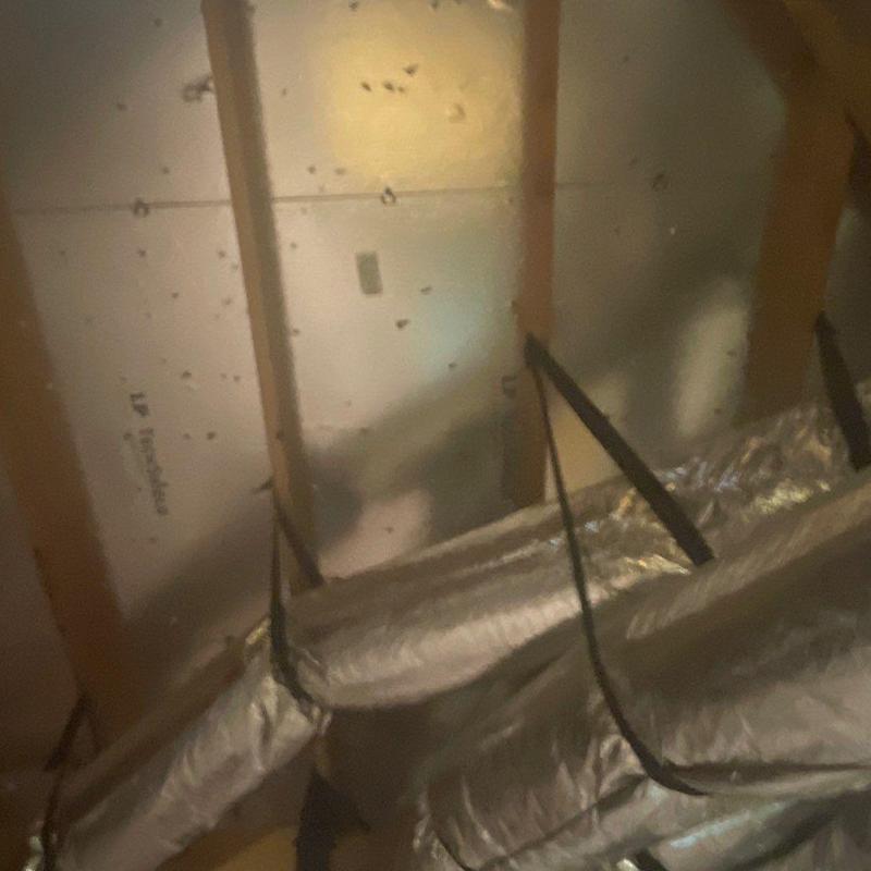 Attic ductwork with support straps installation Attic ductwork with support straps installation