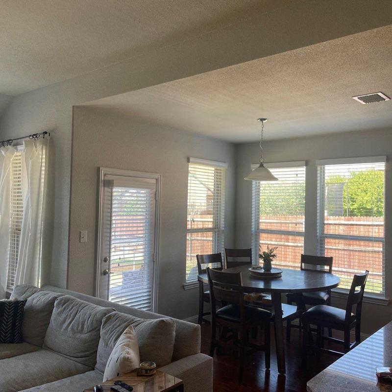 Interior dining area with window blinds and seating Interior dining area with window blinds and seating