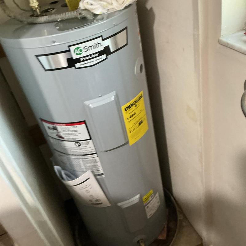 40-gallon electric water heater installation in utility closet 40-gallon electric water heater installation in utility closet