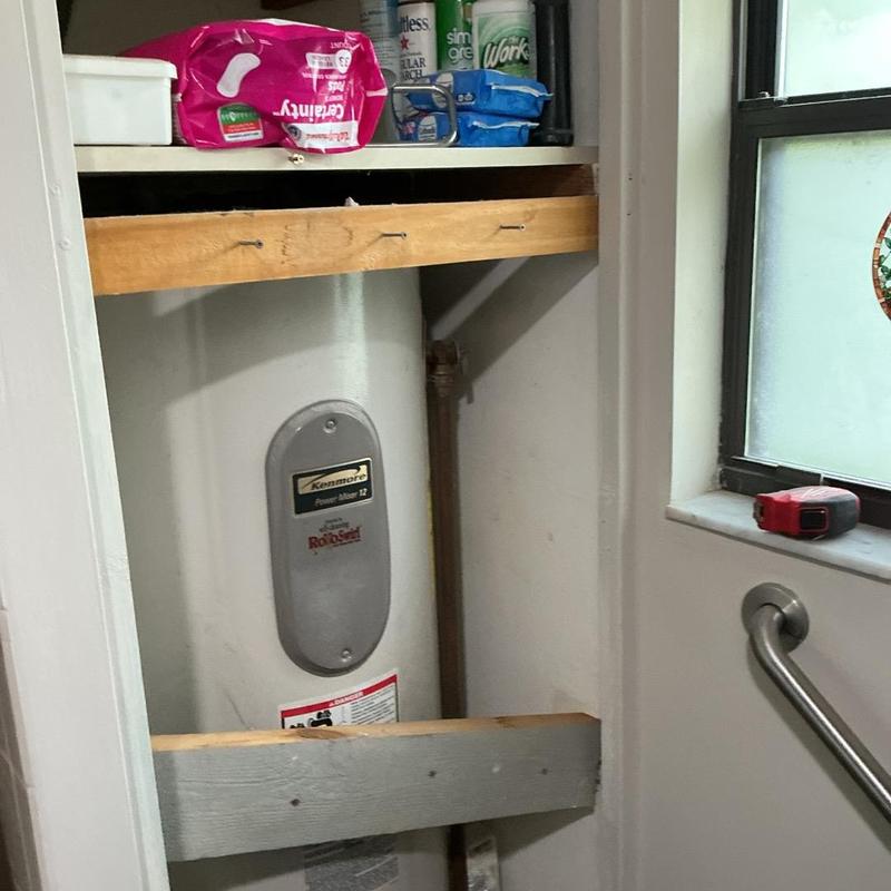 40-gallon electric water heater in utility closet 40-gallon electric water heater in utility closet