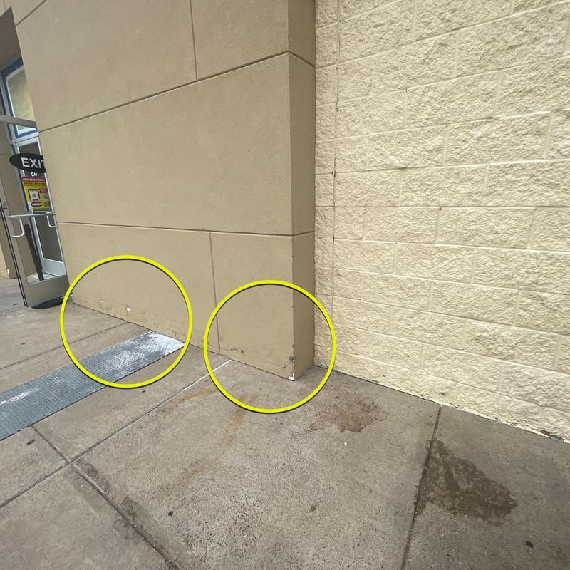 Stucco exterior wall damage and cracks near base Stucco exterior wall damage and cracks near base