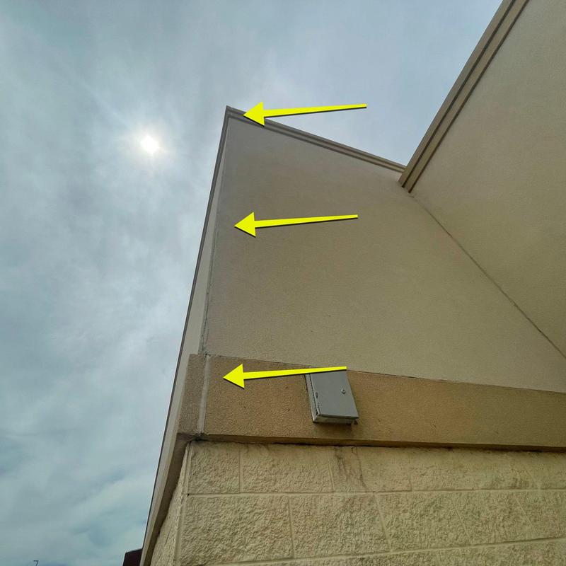 Stucco joint and trim cracks on building exterior wall Stucco joint and trim cracks on building exterior wall