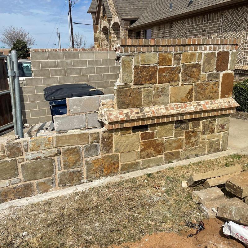 Stone and brick wall masonry restoration in progress Stone and brick wall masonry restoration in progress