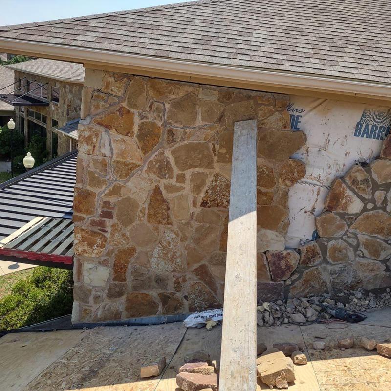 Exterior stone veneer installation on building wall Exterior stone veneer installation on building wall