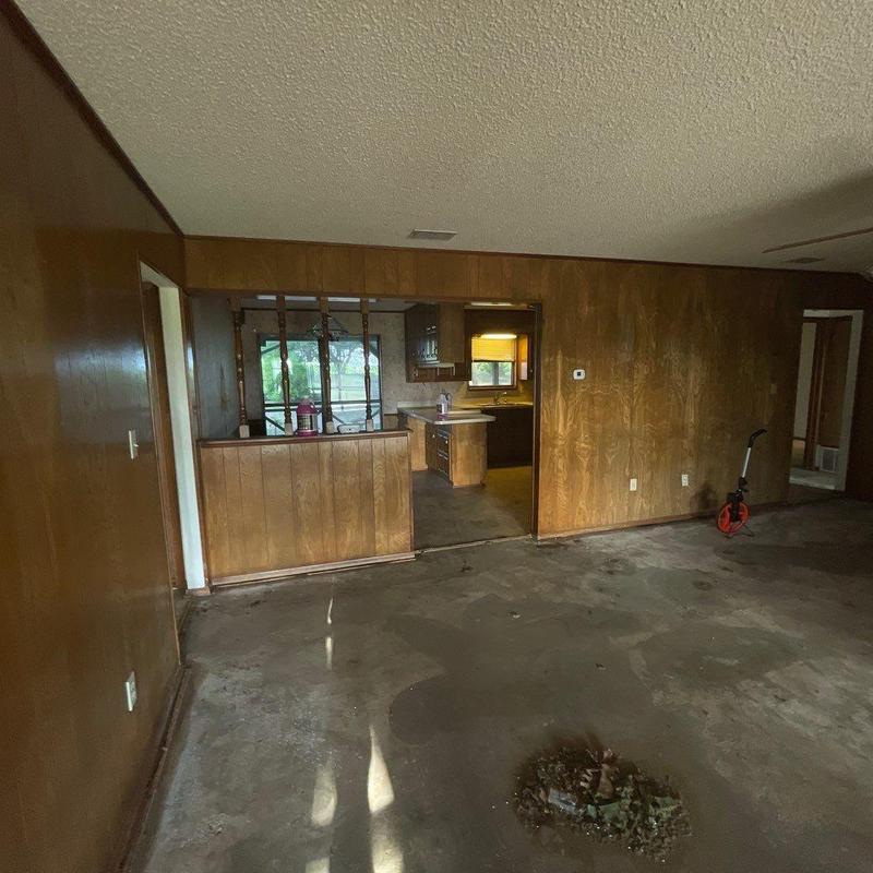 Concrete floors with wood paneling in interior remodel Concrete floors with wood paneling in interior remodel