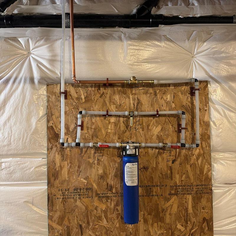 Water filtration system with bypass and check valve installation