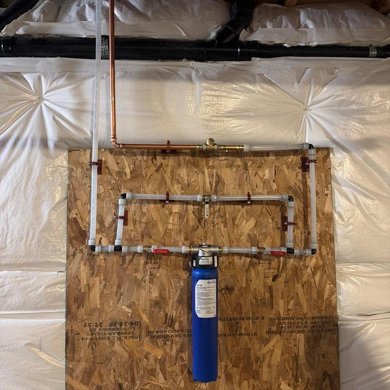 Water filtration system with bypass and check valve installation