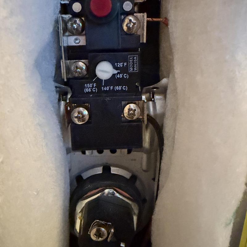 Water heater thermostat and element replacement close-up Water heater thermostat and element replacement close-up