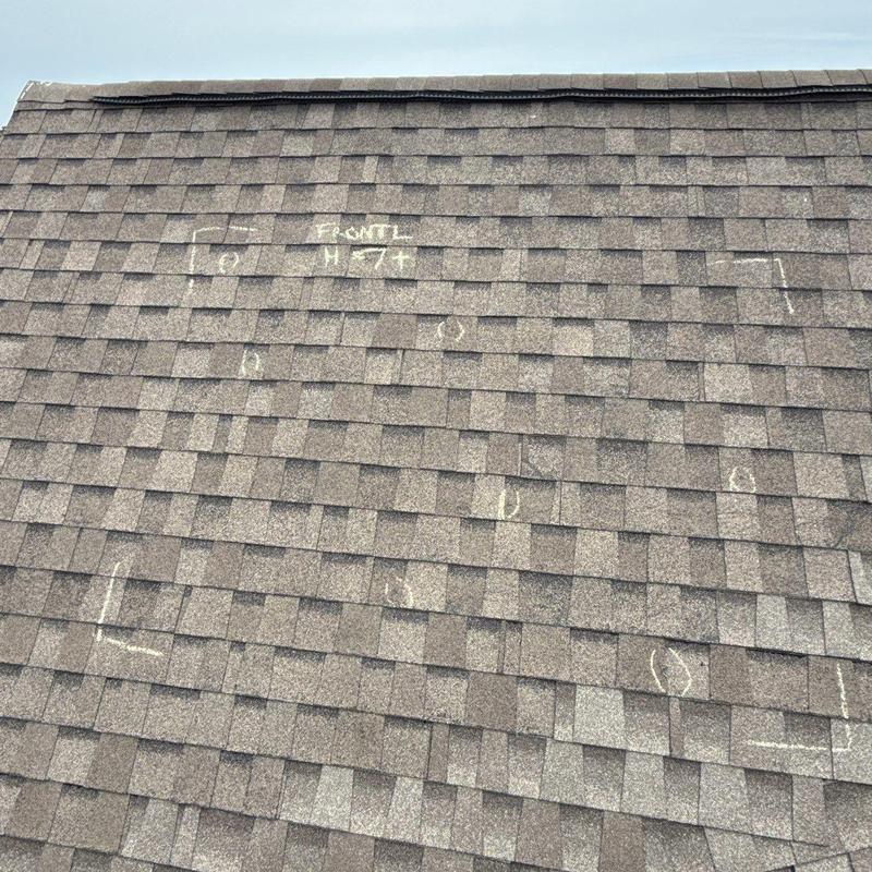 Asphalt shingle roof hail damage markings inspection