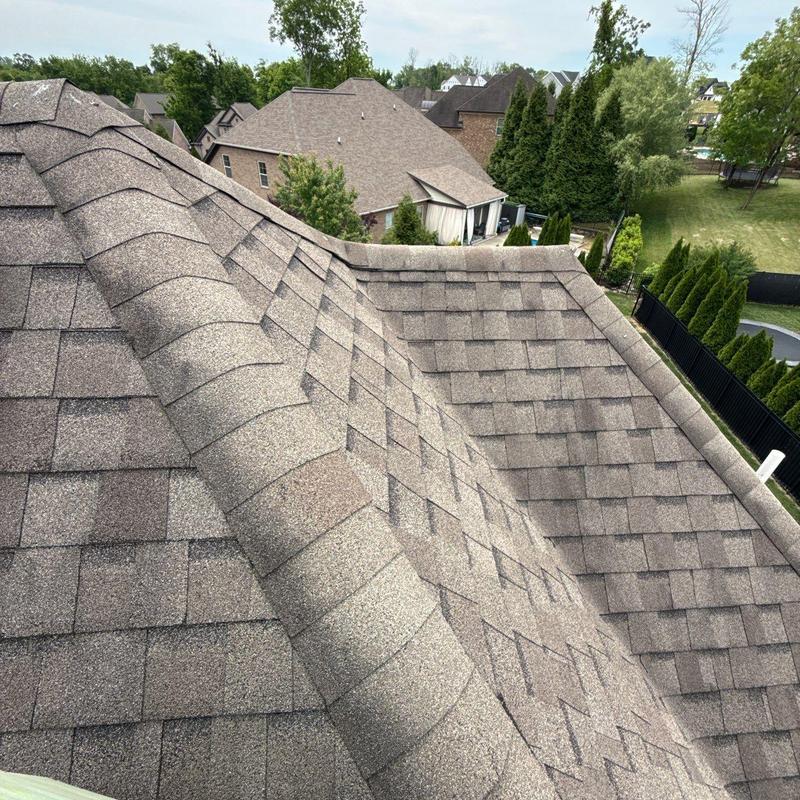 Asphalt shingle roof ridge and surface inspection