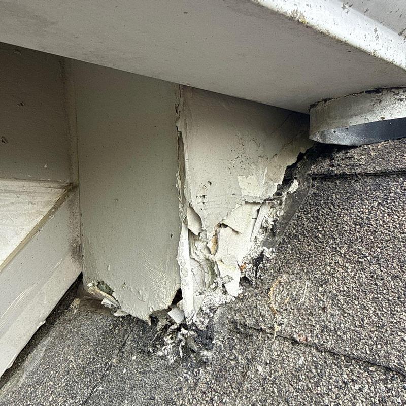 Roof flashing with cracked and peeling sealant on shingles