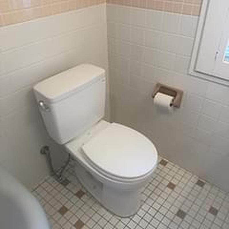 Toilet installation with flange repair in bathroom corner