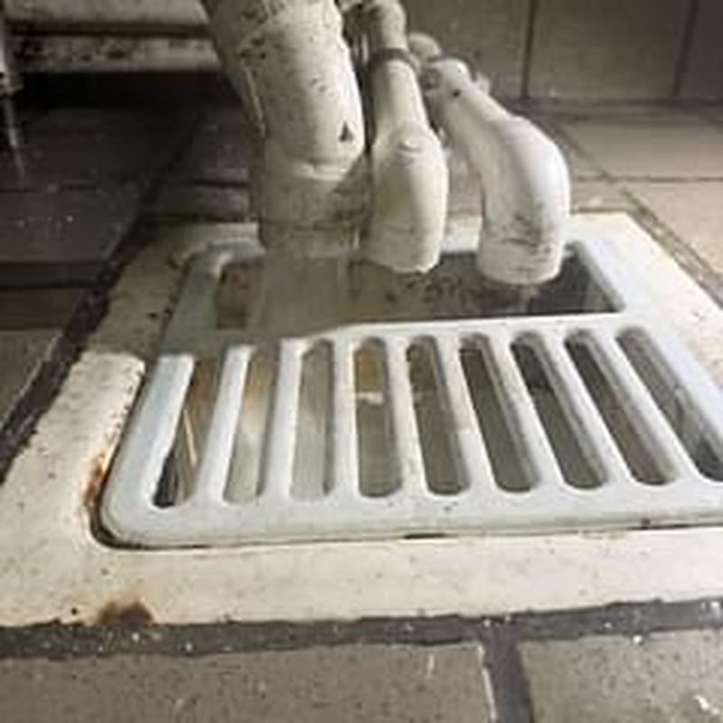 Floor sink drain pipes with air gaps and securing