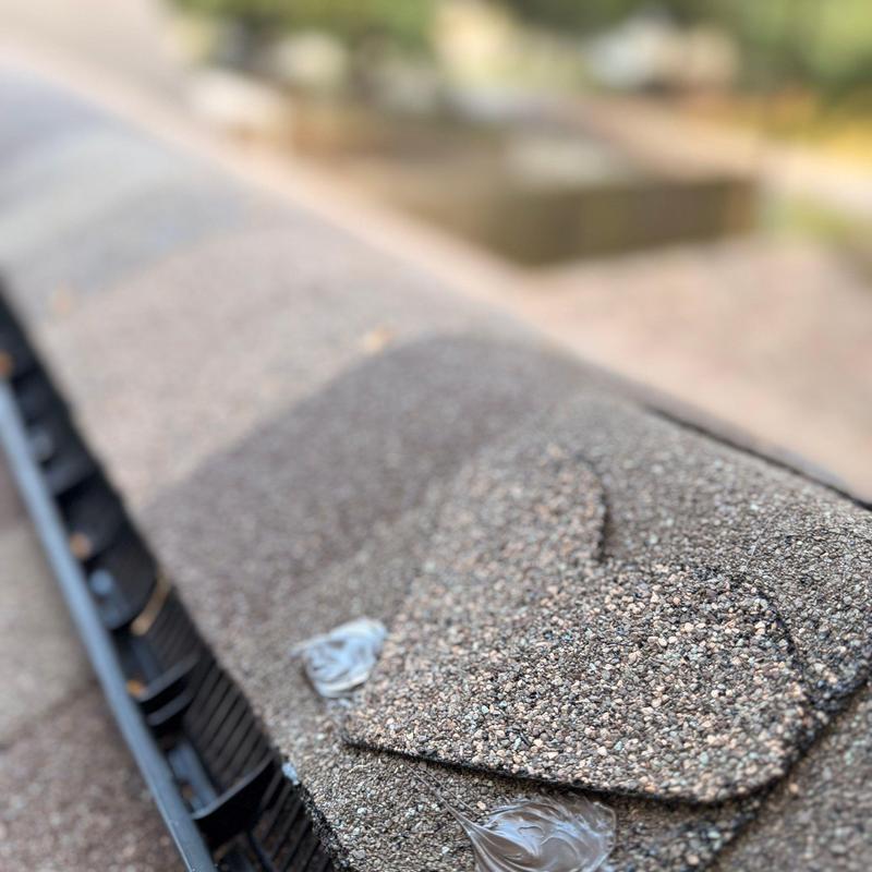 Tamko Titan XT shingles on roof ridge cap close-up Tamko Titan XT shingles on roof ridge cap close-up